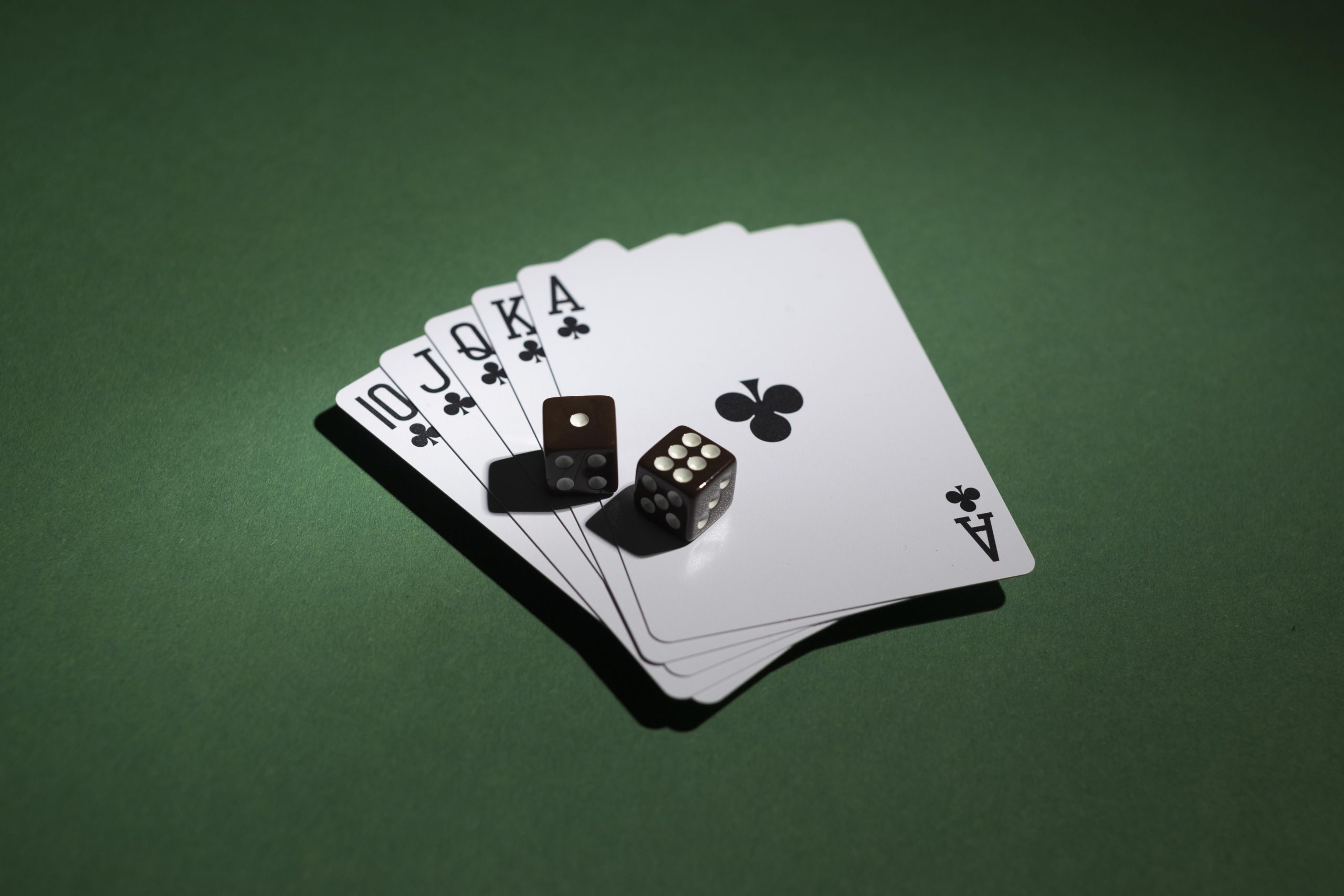 royal-flush-cards-with-dices-green-background